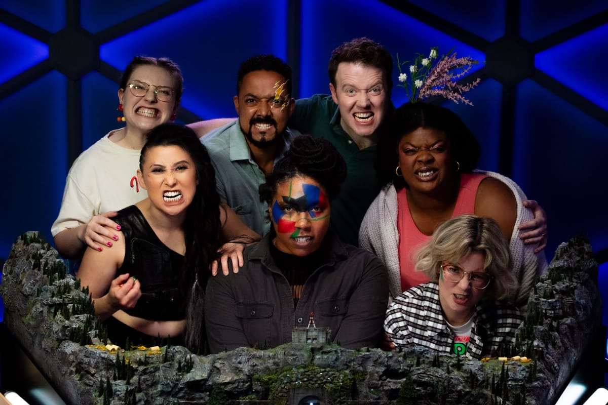 Rashawn and Jasper with the rest of the Dimension 20 Burrow's End cast promoting POC in the TTRPG space