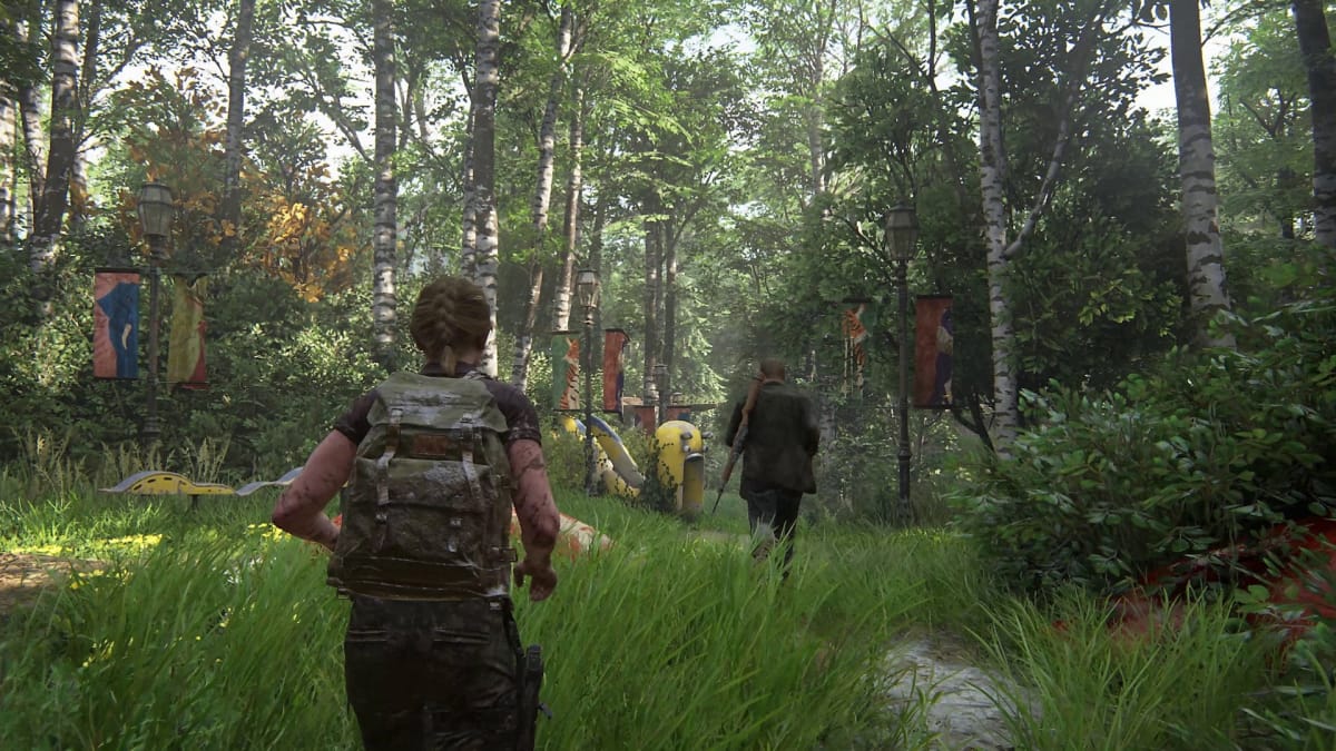 Abby chasing after another character in a verdant forest in The Last of Us Part 2 Remastered, representing The Last of Us being the Google year end search list's second most-searched gaming term
