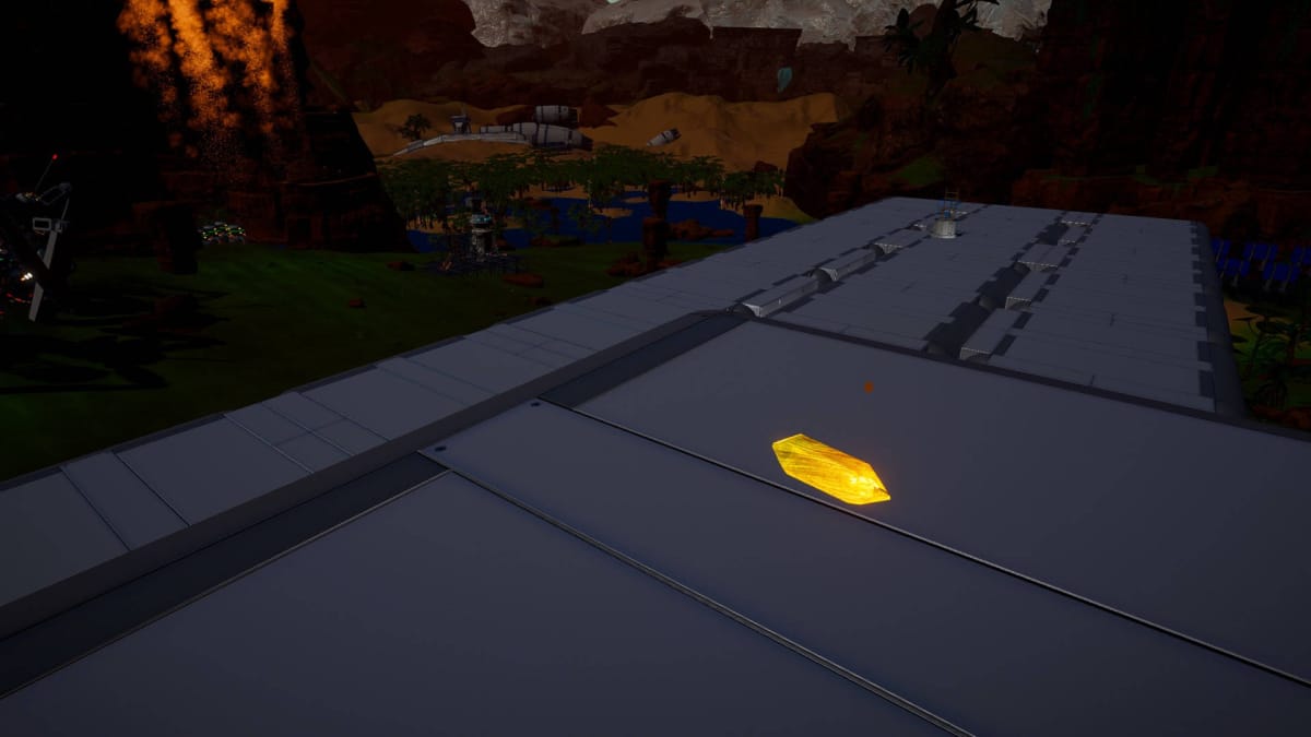 A piece of Solar Quartz sitting on the roof of a large building in The Planet Crafter