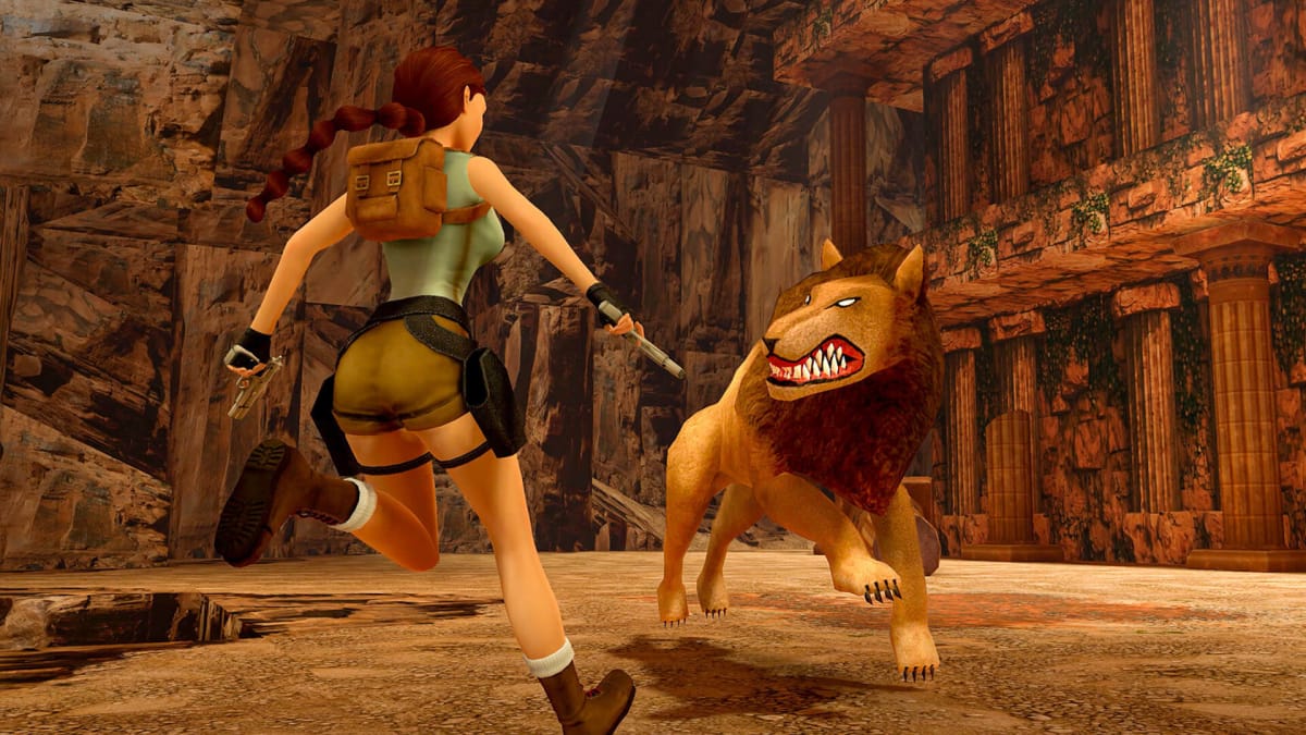 Lara facing off against a vicious-looking lion in the recent Tomb Raider remasters
