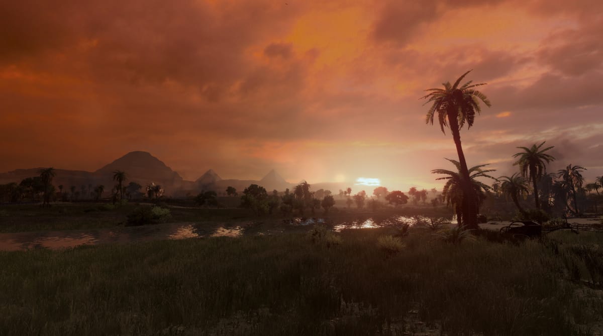 A sunset with the Nyle and the mighty Pyramids in Total War: Pharaoh