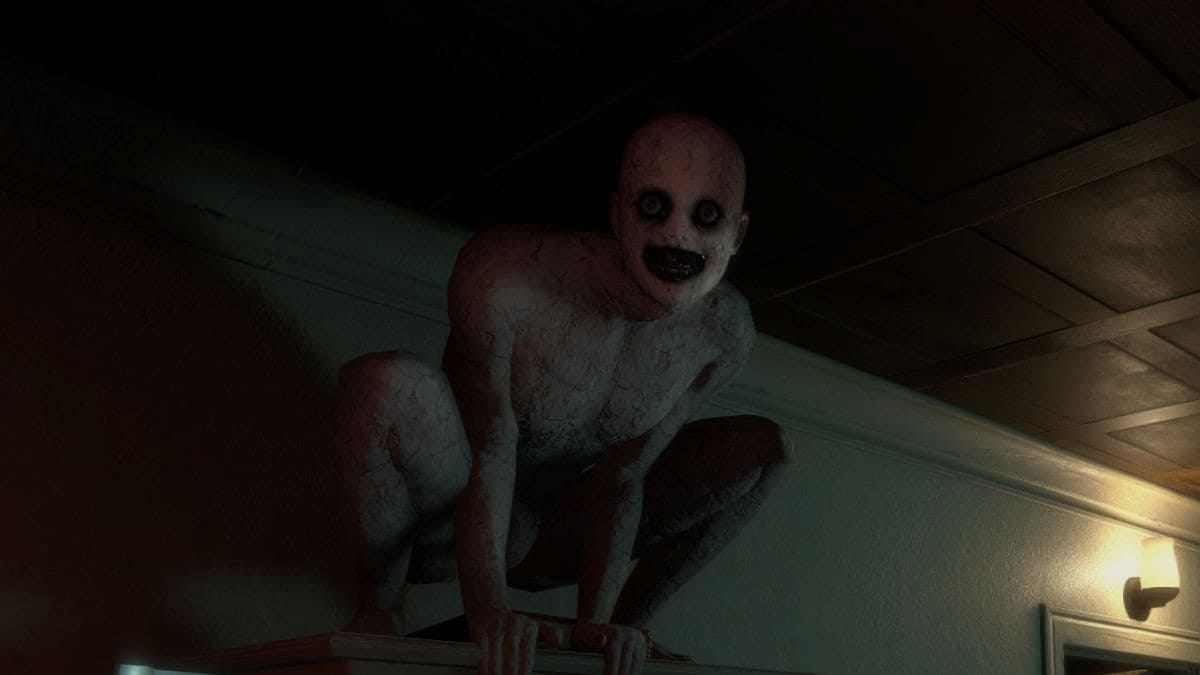 Image from The Mortuary Assistant where a demon is perched above the player staring into your eyes, invoking pure fear with their dark black ringed eyes and white, almost charred looking body.  The Mortuary Assistant Movie