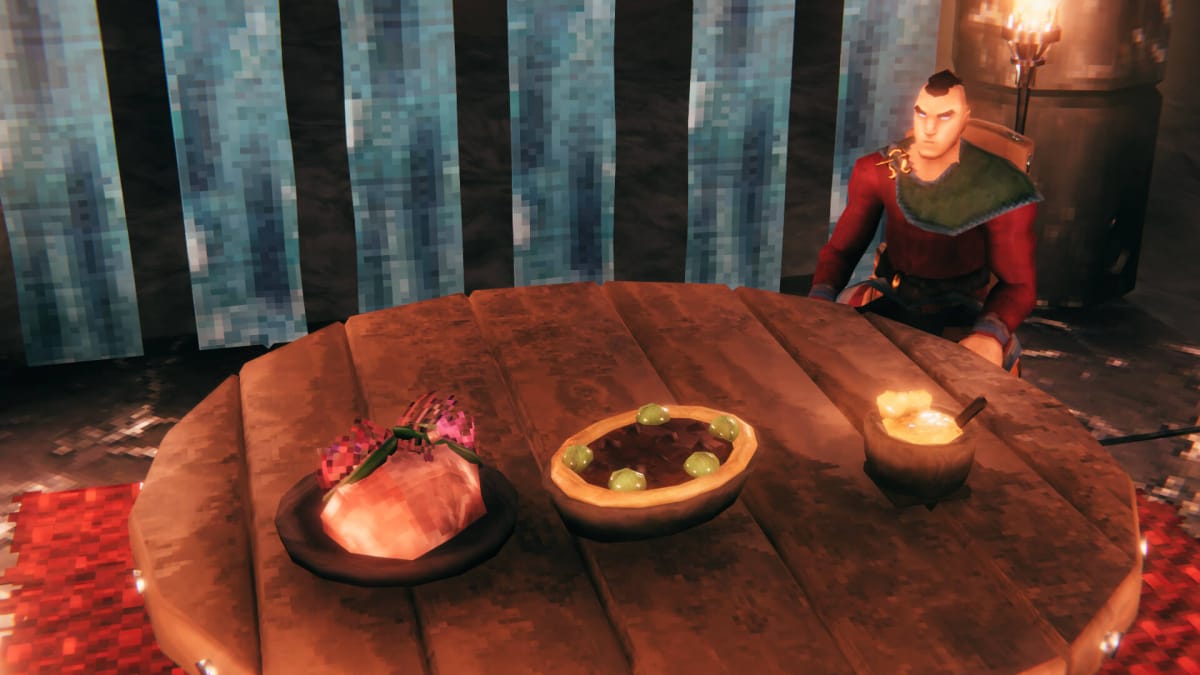 A character sitting at a table with three new dishes on it in the Valheim Ashlands update