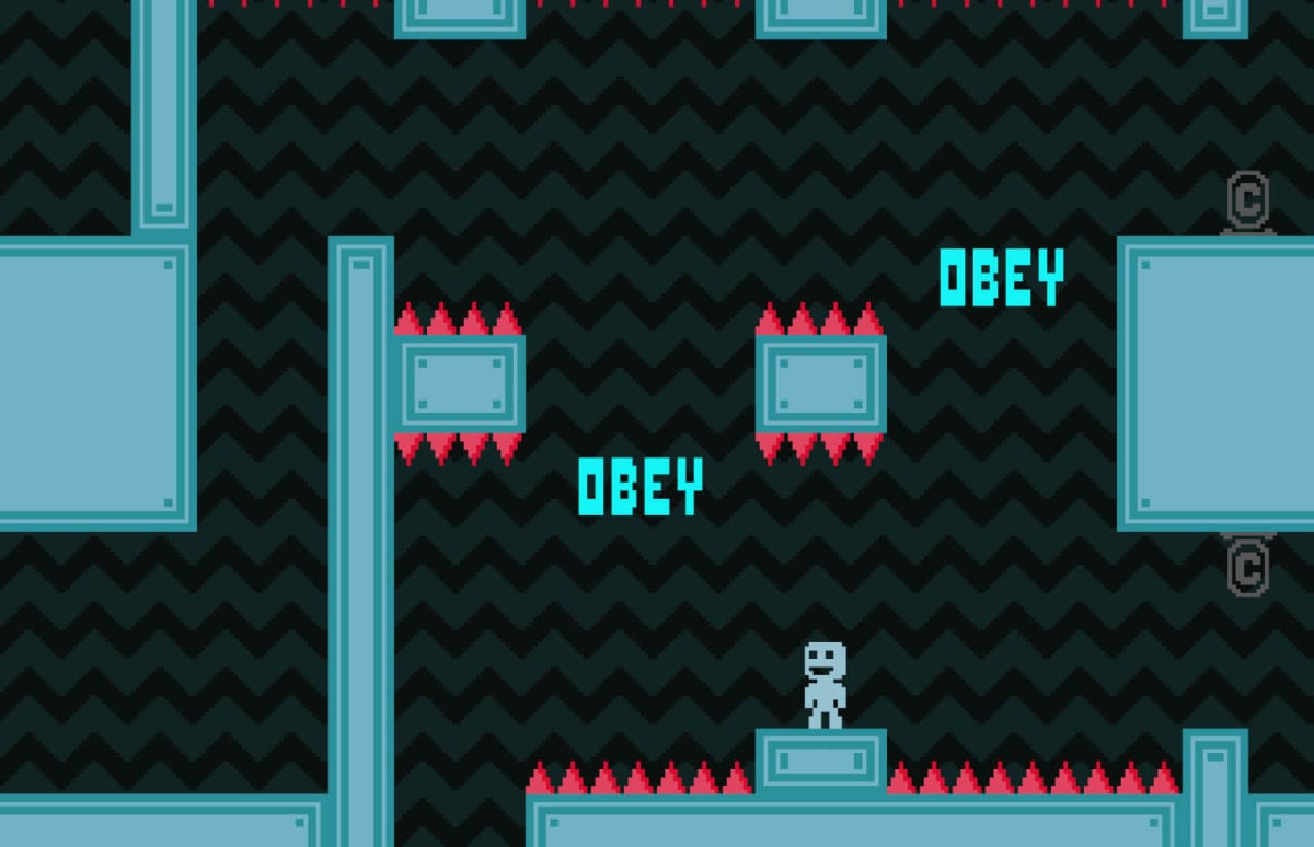 The player standing in a stage covered in spikes with "OBEY" written in the background in VVVVVV