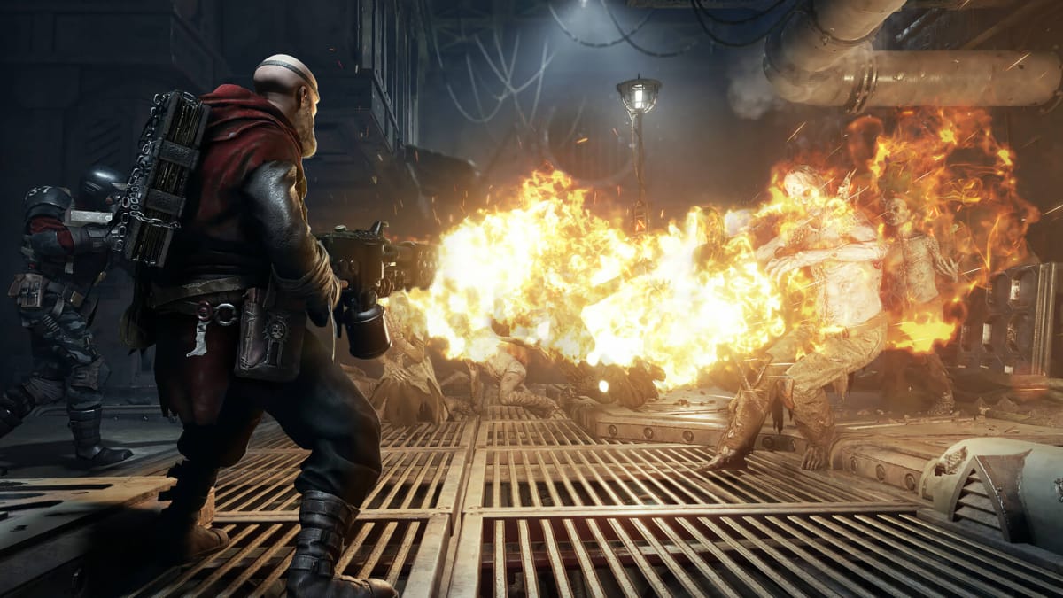 Player characters torching a wave of enemies in Warhammer 40,000: Darktide