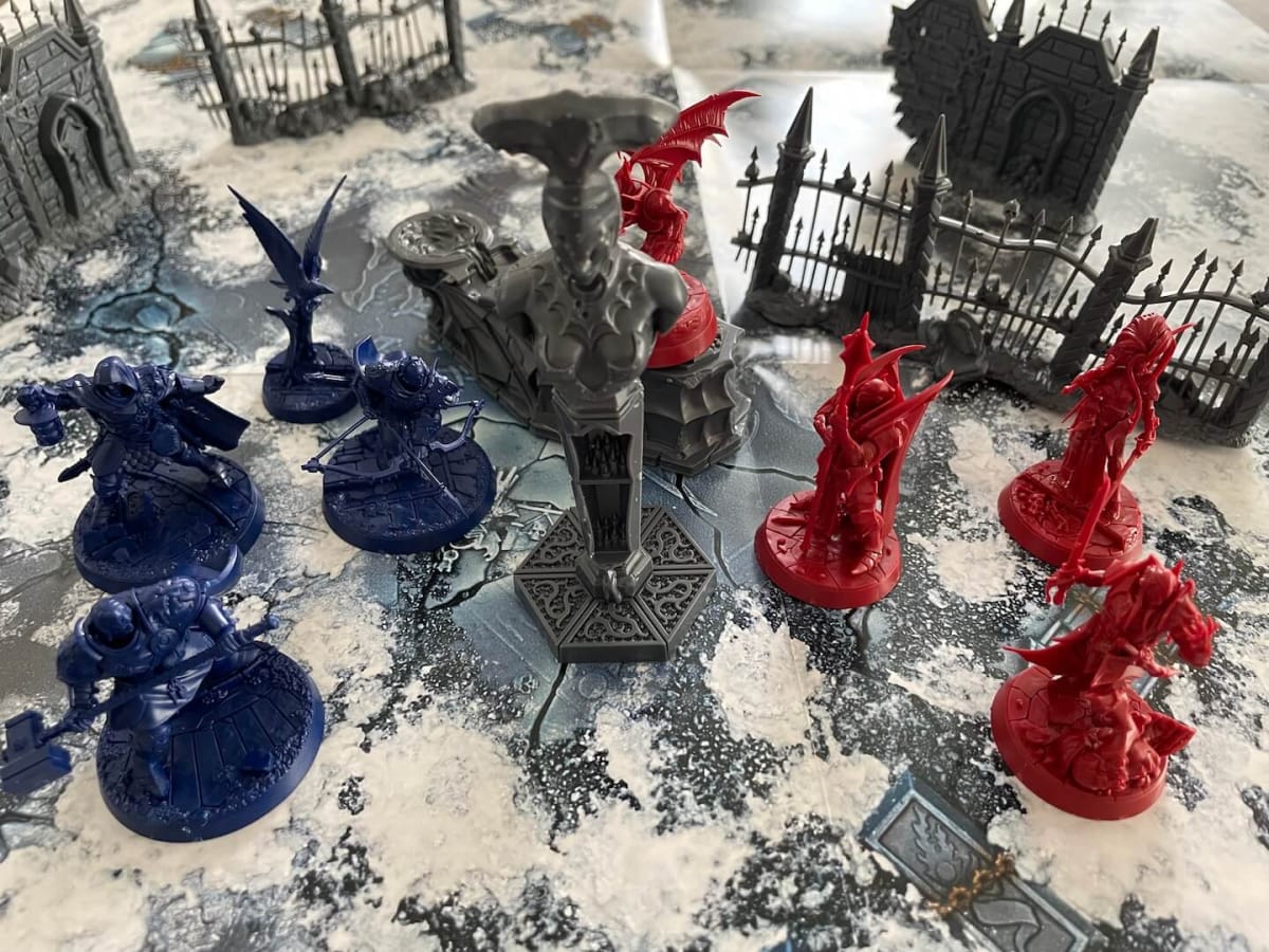 An image from Warhammer Warcry Crypt of Blood Review depicting miniatures in battle against one another