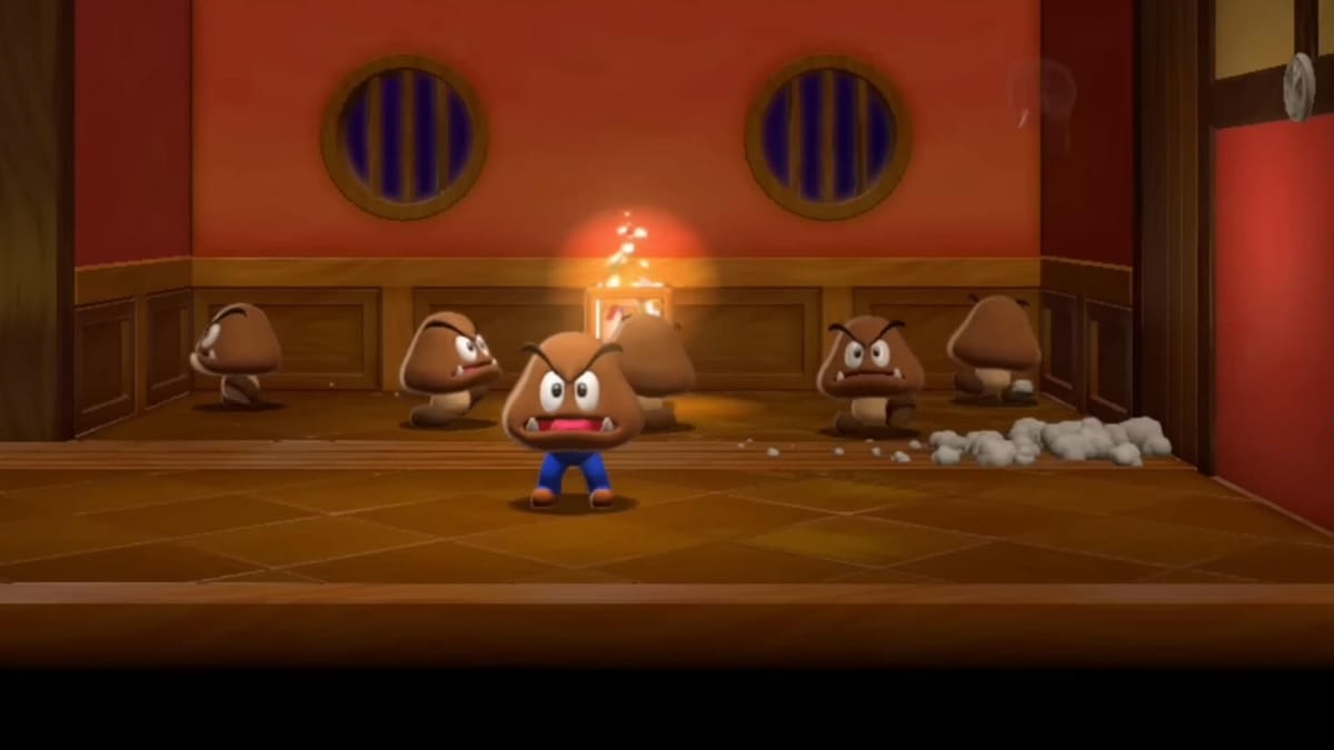 Mario in a Goomba costume standing around with other Goombas in the Wii U game Super Mario 3D World