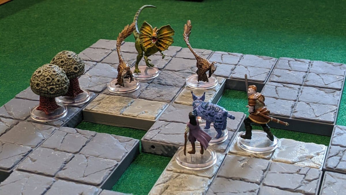 Dinosaurs against a small party in Wizkids Bigby Presents Glory of the Giants