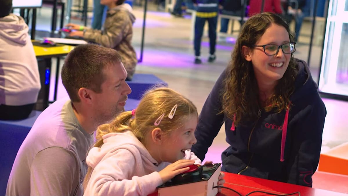 A family enjoys an exhibit at the National Videogame Museum