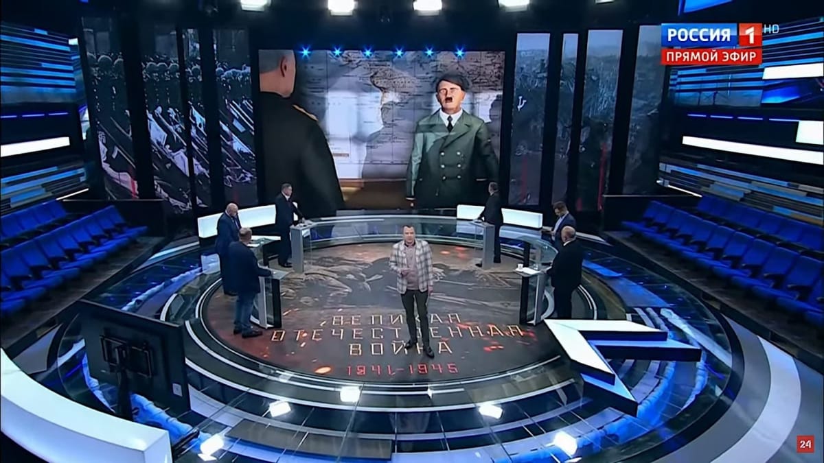 A Russian news channel discussing Strategic Mind: Blitzkrieg's alleged Nazi propaganda