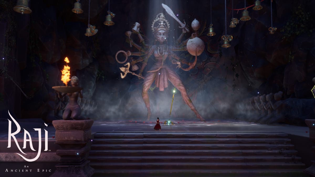 Raji standing in front of a statue of the god Vishnu
