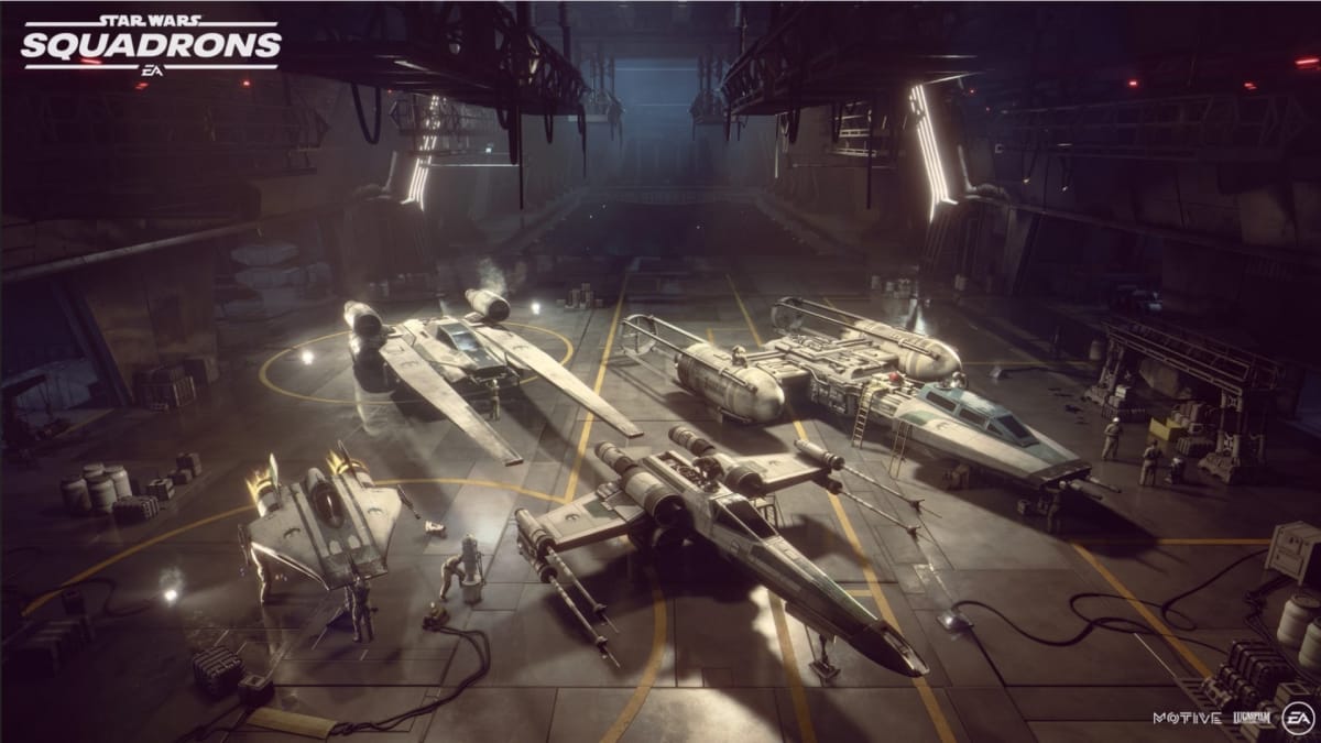 The image of a hangar with four spaceships in it