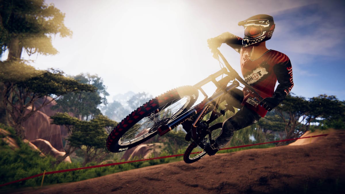 A cyclist riding downhill in Descenders
