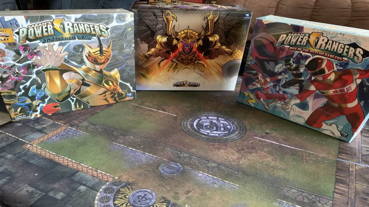 A photo of the Kickstarter box and the expansions propped up on a table