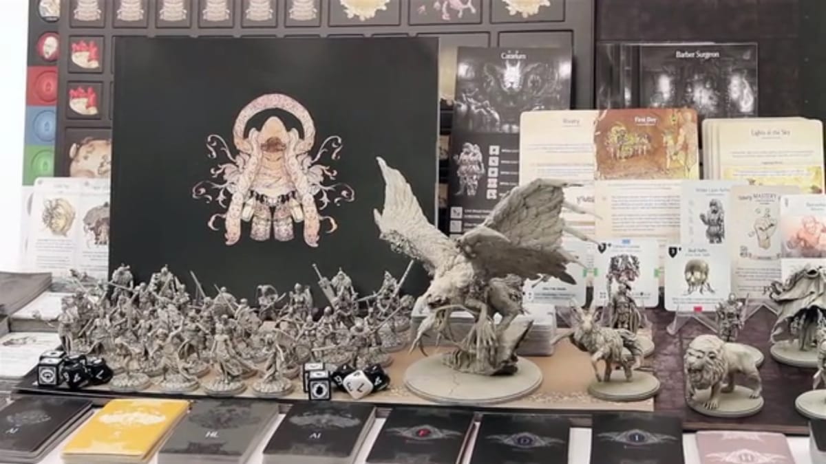 The box art, cards, and figures seen in the base version of Kingdom Death: Monster