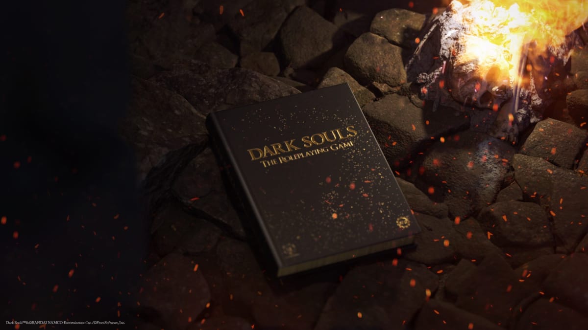 The Collector's Edition of the Dark Souls tabletop RPG next to a bonfire