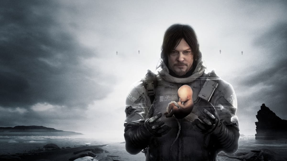 Death Stranding screenshot with main character holding a baby that is still attached to the umbilical cord standing in a dim and grim black and white scene of rocks and water behind him 