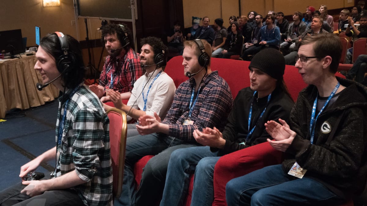 Several gamers spectating someone playing at Awesome Games Done Quick in 2018