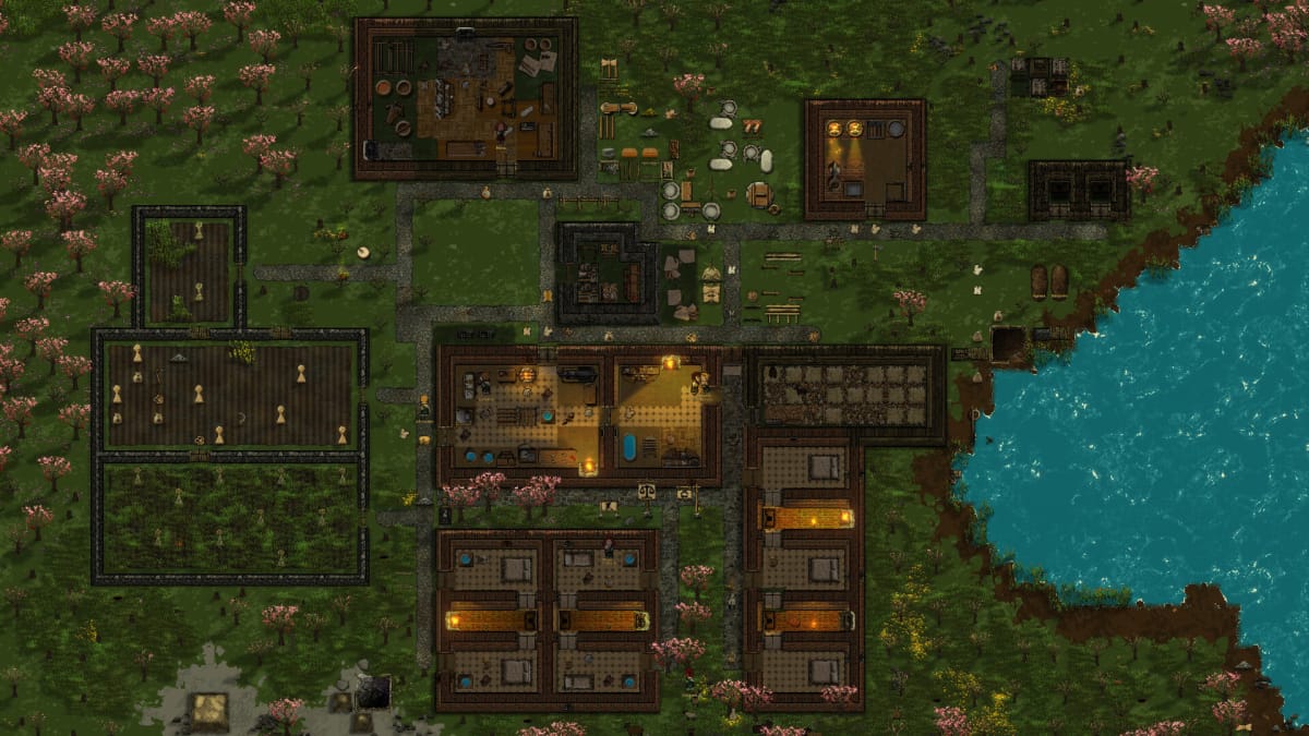 A top-down view of a colony surrounded by trees and water in Clanfolk
