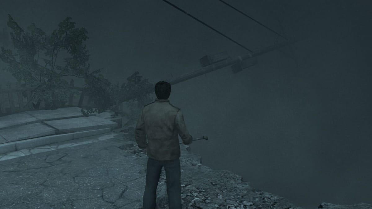 Alex standing in a foggy street in Silent Hill: Homecoming, which won't be the new Silent Hill game (thankfully)