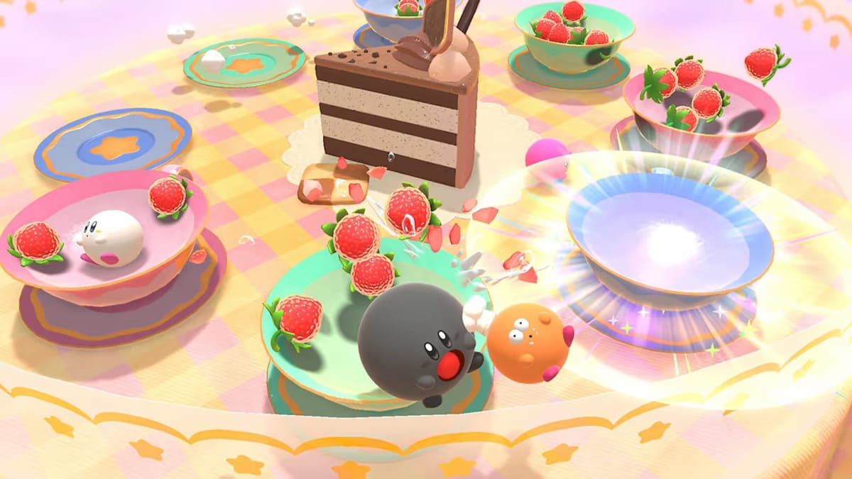 Screenshot of Kirby's Dream Buffet gameplay, where we see dishes, a large cake and strawberries strewn about