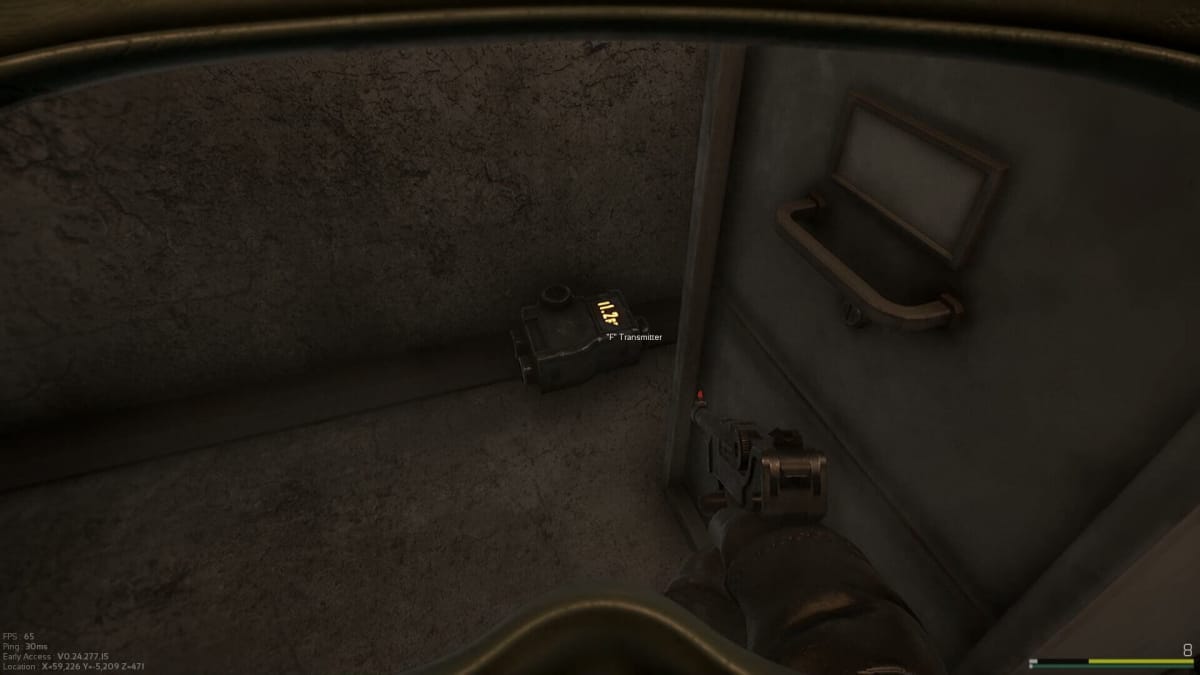 Marauders Transmitter item hidden between a desk and cabinet in the Iridium Asteroid Mine.