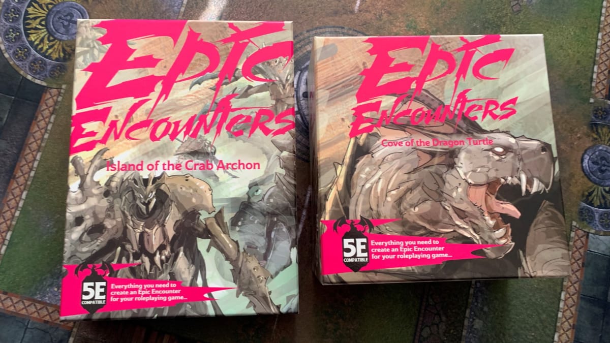 Photos of boxes from Epic Encounters: Island of the Crab Archon and Cove of the Dragon Turtle