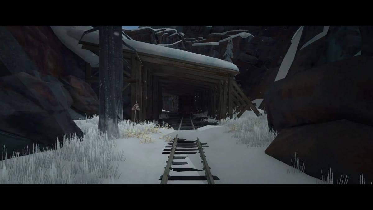 Screenshot from the long dark of an abandoned train track, covered in snow and looking toward a tunnel, The Long Dark Expansion Pass 