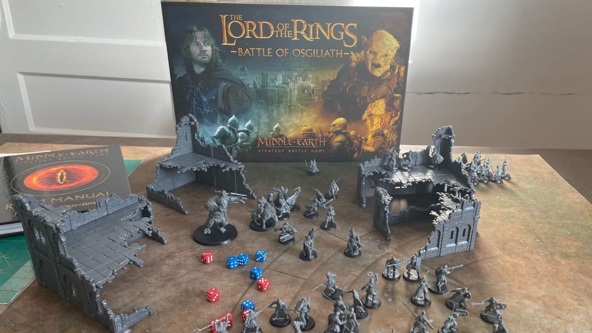 The box contents of Lord of the Rings: Battle of Osgiliath, including built minis featuring orcs and rangers of gondor