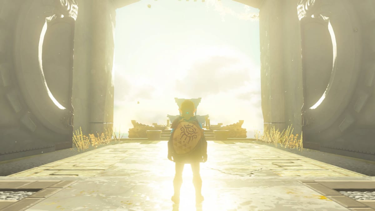 Link standing in a doorway framed by sunlight in Zelda Tears of the Kingdom
