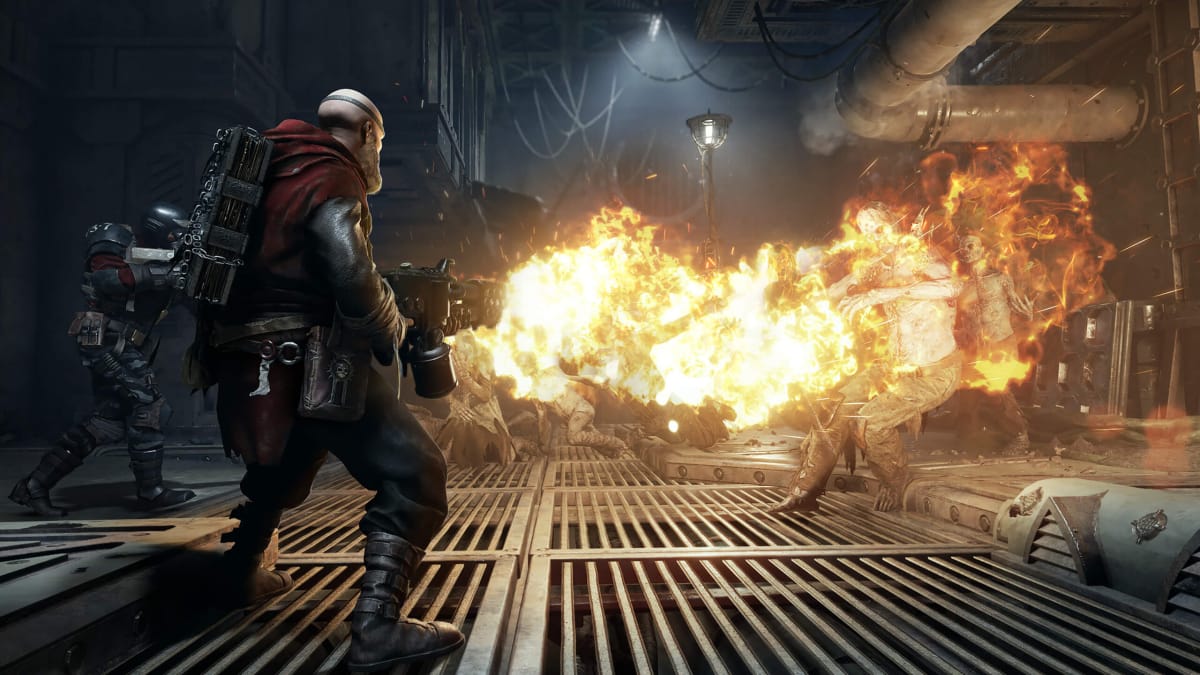 A player firing a flamethrower at a horde in Warhammer 40k: Darktide