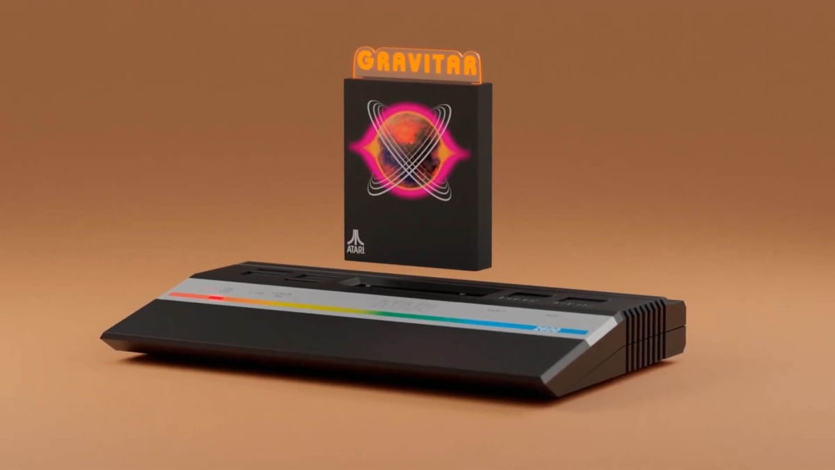 A cartridge for the game Gravitar being inserted into an Atari 2600