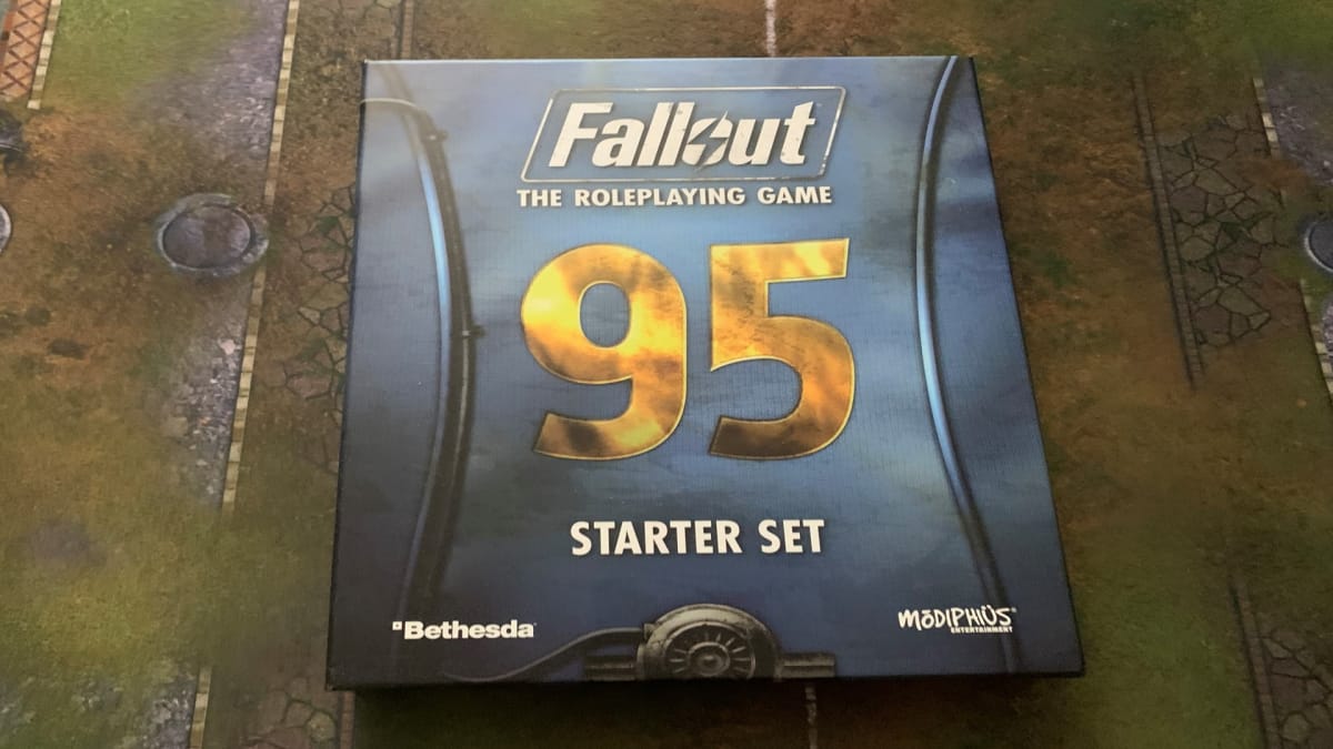 The Fallout RPG Starter Set box set on a game mat.