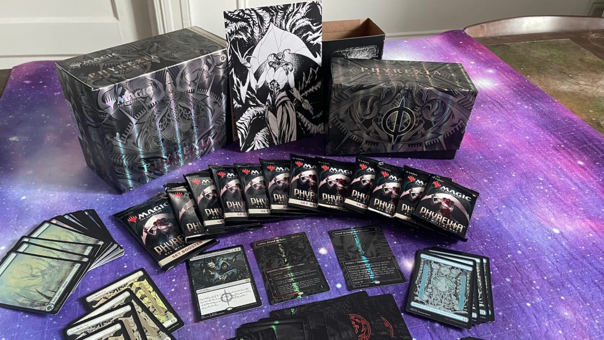 A photo of all the contents in Phyrexia All Will Be One Bundle: Compleat Edition