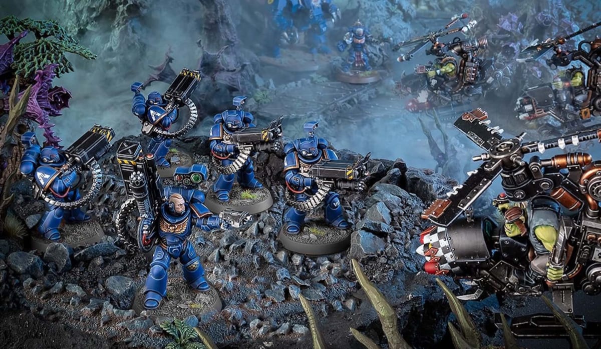 An image of the Strike Force Agastus from Warhammer 40K, painted in Ultramarine colors fending off a Xenos hoard.