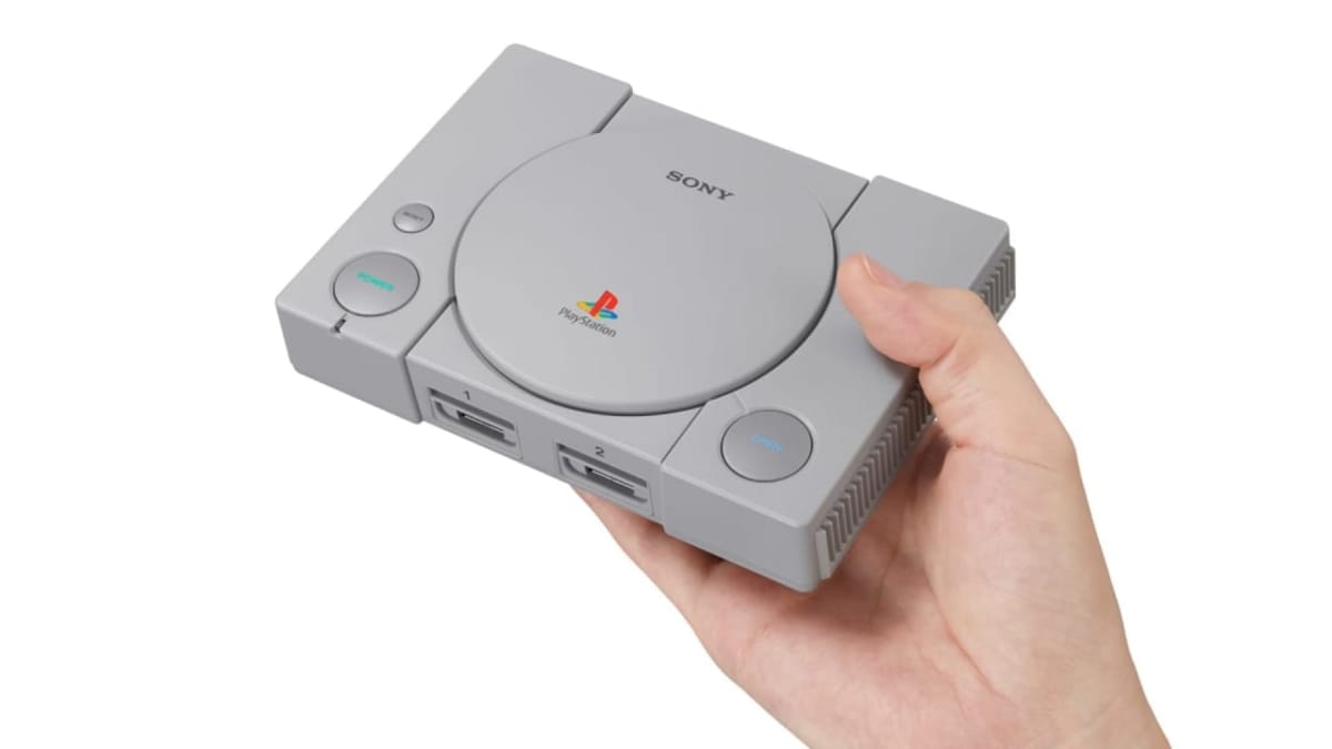 Playstation Classic Being Held in a Hand