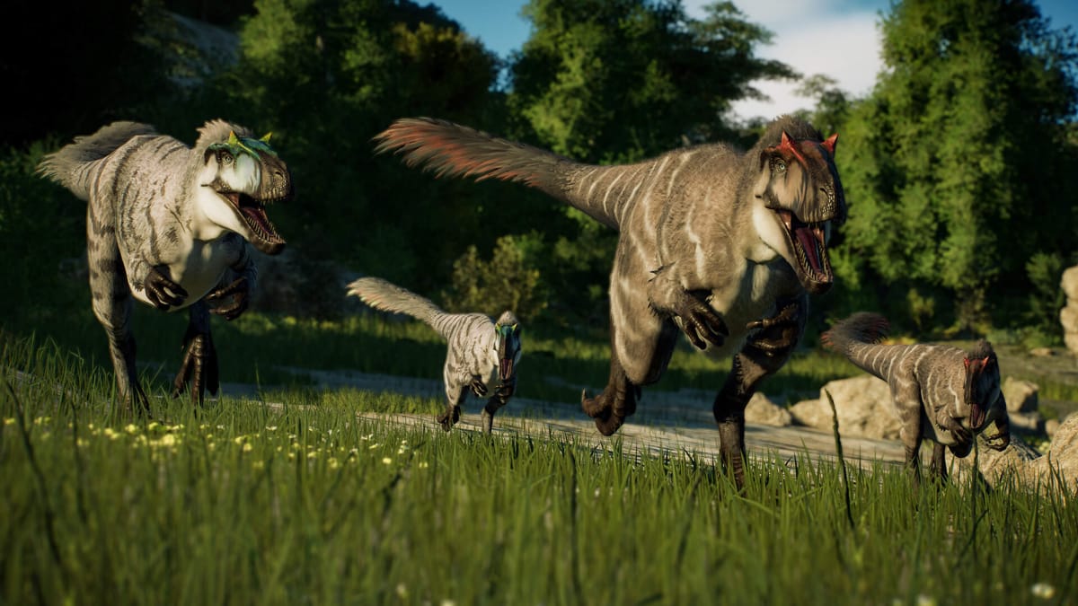 Several feathered dinosaurs running in the new Jurassic World Evolution 2 DLC