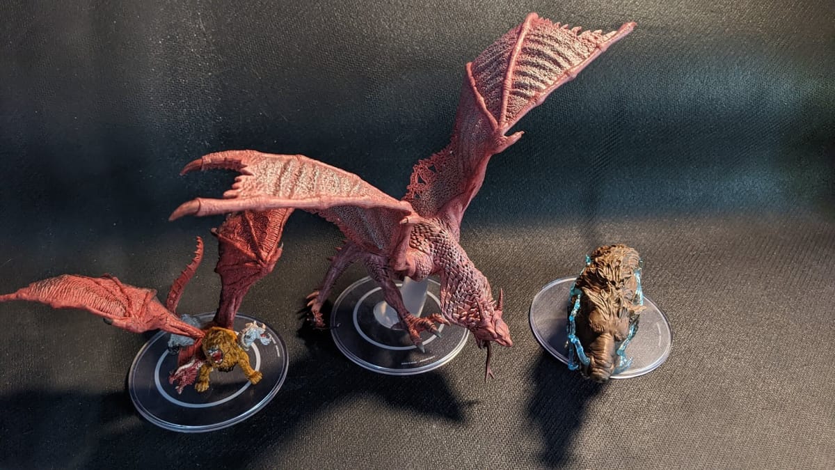 An image of the Wyvern, Chimera, and Thunder Boar from Wizkids Sand and Stone Set