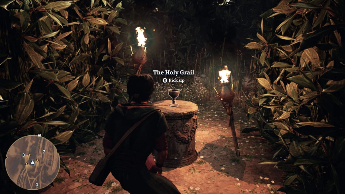 The player crouching in front of the Holy Grail (yes, really) and being prompted to pick it up in the Bible game Gate Zero