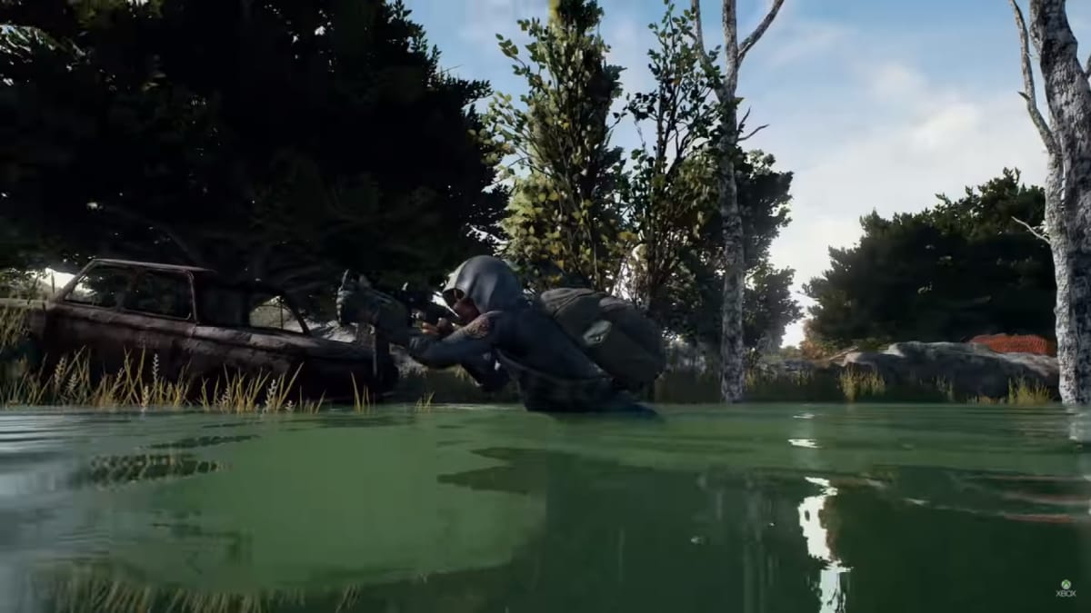 PUB screenshot showing a soldier walking through the swamp with their gun drawn. 