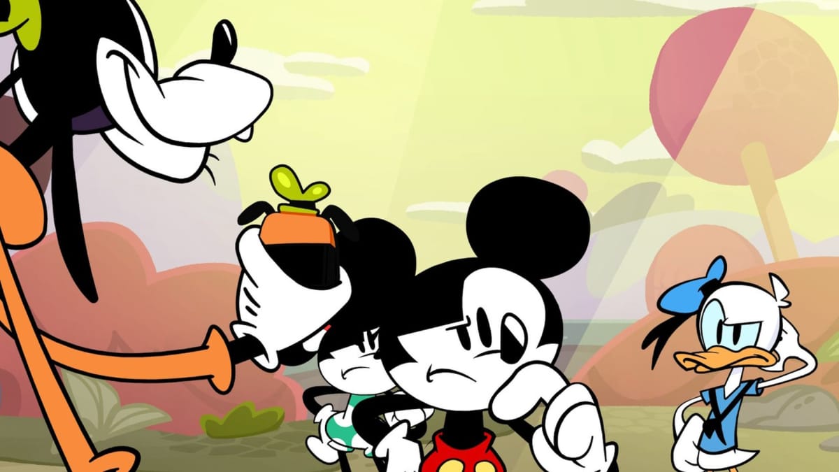 Mickey and the gang hatching a plan in Disney Illusion Island