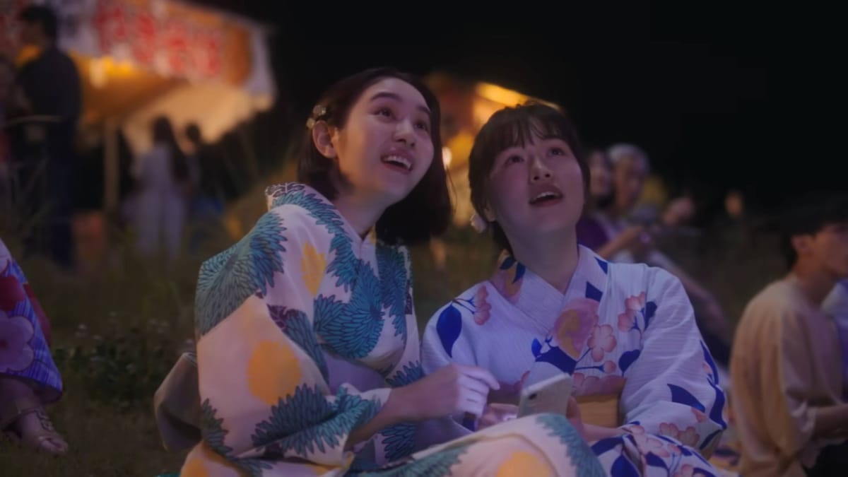 Sisters enjoying the fireworks in Nintendo Switch summer commercials