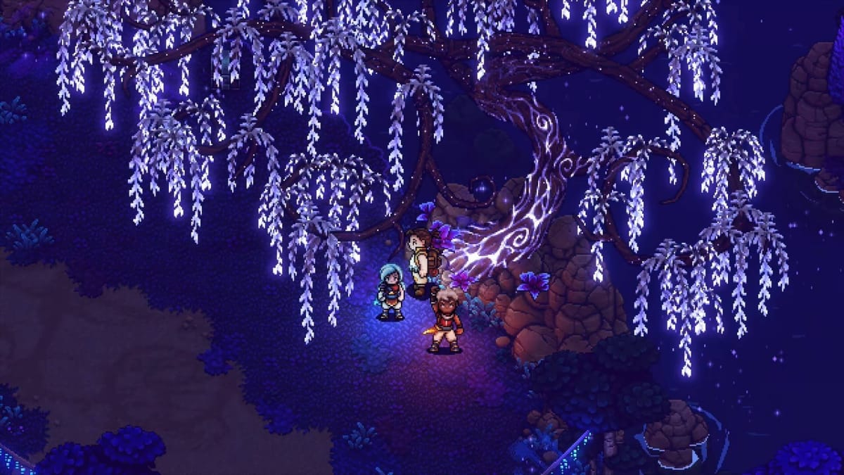 Zale holding up his hand while his friends look on and a tree lights up in Sea of Stars