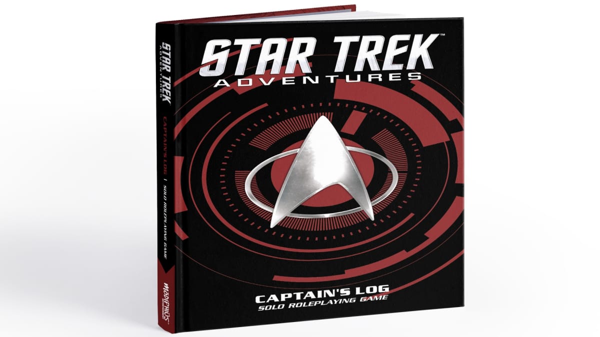A screenshot of the hardcover of Star Trek Captain's Log Solo Roleplaying Game, featuring the artwork and combadge from Star Trek: The Next Generation.