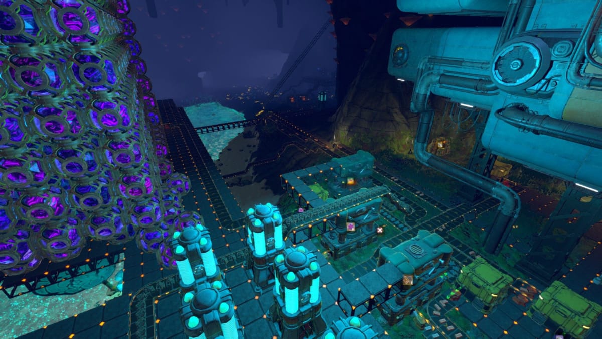 Techtonica screenshot showing a huge amount of automation in a factory with many strange machines and conveyor belts splayed across an open cavern. 