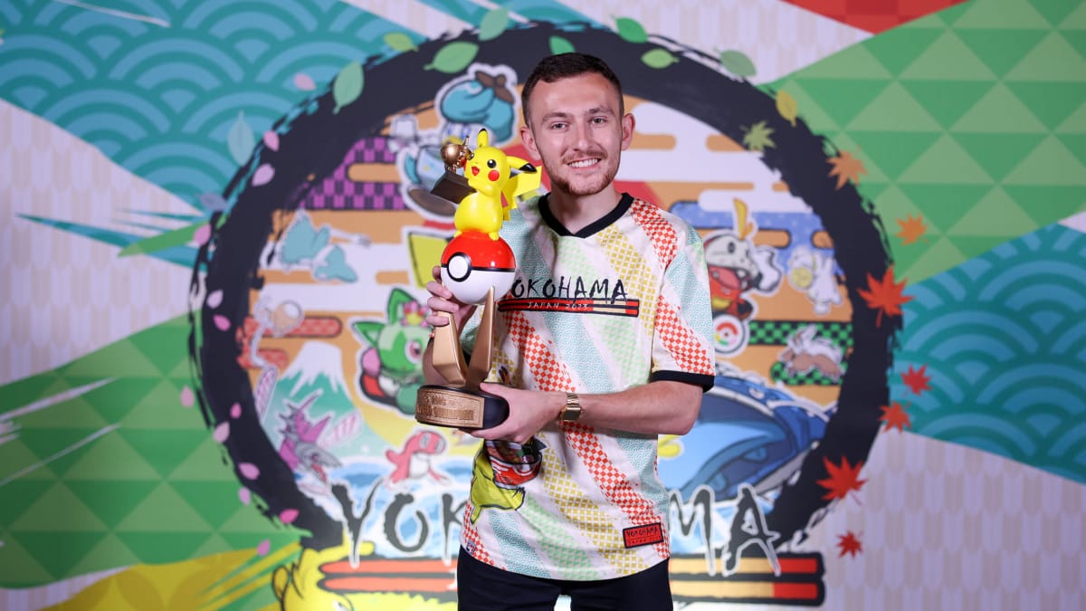 Vance Kelley, one of the winners at the Pokemon World Championships 2023, holding a Pikachu trophy