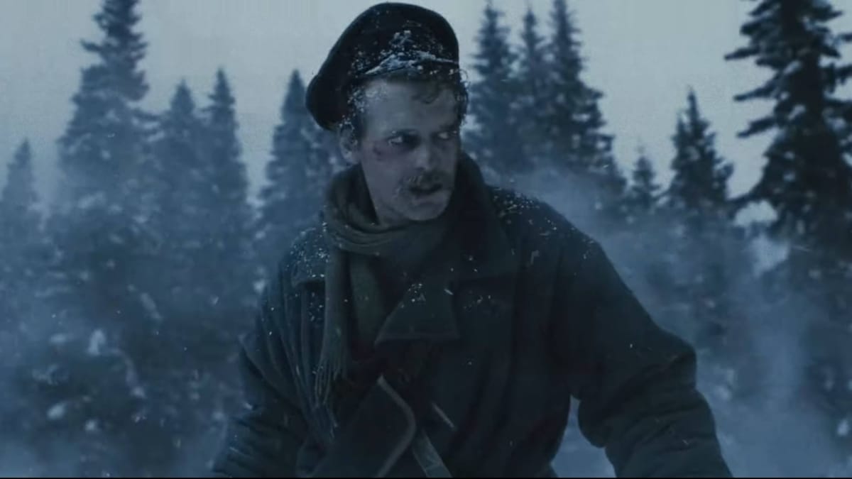 A soldier looking scared in a snowy forest in The War of the Worlds: Siberia