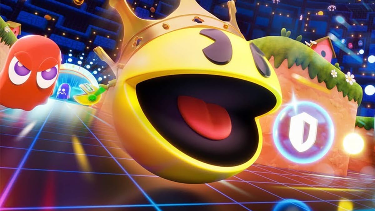 Pac-Man looking suitably angry as he seeks to devour all in his path while a ghost looks on in the new Pac-Man battle royale game Pac-Man Mega Tunnel Battle: Chomp Champs