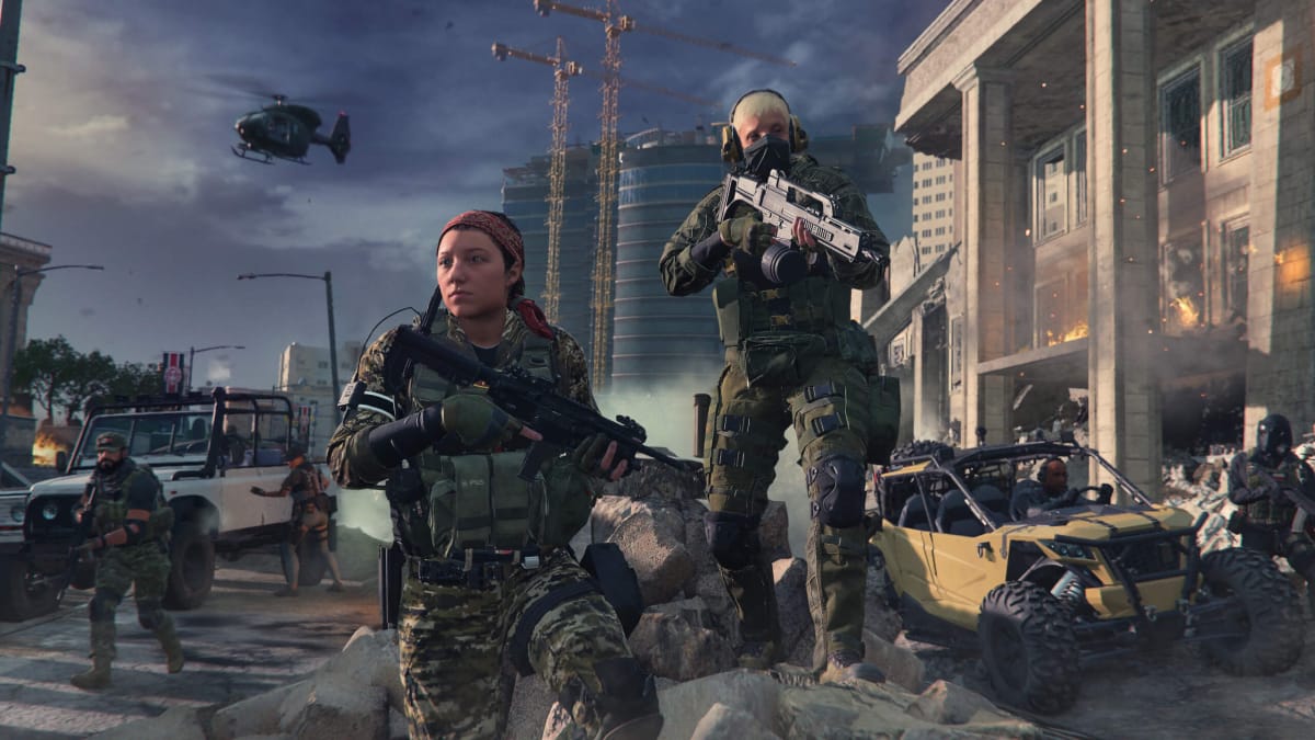 Two soldiers standing heroically with rifles and looking into the distance against the backdrop of a warzone in Call of Duty: Modern Warfare 3, which is number one in the UK boxed sales charts