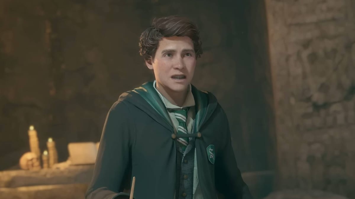 A Slytherin student clutching a wand in Hogwarts Legacy, the number one game in this week's UK boxed sales charts
